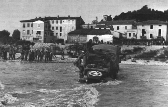 Photo: UNIT OF THE 370th RCT CROSSING THE SERCHIO BY TRUCK,