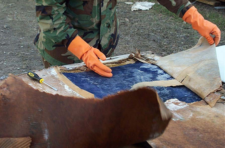 Photo: Careful handling was required to recover and preserve many of the delicate historic military artifacts. A three-person team and later an eight person team from Illinois and Pennsylvania, spent a total of four weeks in New Orleans supporting the Museum Curator Stan Amerski with his salvage efforts.