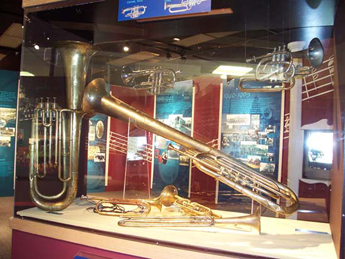 Photo: The museum possesses a number of vintage band instruments supplied to the Army by the Quartermaster Corps. This case contains a Civil War-era E Flat bass horn over the shoulder model and a selection of trumpets dating from 1885 to the 1950's. All photographs courtesy of Tim O’Gorman.