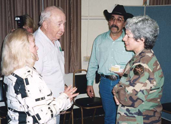 Photo: Fort Sam Houston Garrison Commander, Colonel Wendy Martinson (right), chats with Joan Gaither, President of the Society for the Preservation of Historic Fort Sam Houston, Col. John Olson, historian of the Philippine Scouts Heritage Society and participant in the defense of Bataan in 1942 and Elias San Miguel, Exhibits Specialist, who executed and fabricated the exhibits.