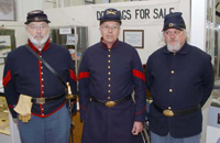 Photo: Left to Right: Re-enactors Steve Fields, Harvey Dietz and Mike Hunter attend the opening. 