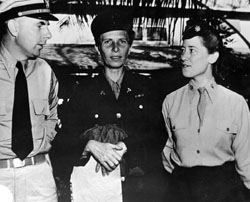 US Army Nurse Beatrice E. Chambers,  	
	   recently delivered from the Jap[anese] Prison Camp Santo Tomas, with her brother and friend upon her arrival at Hickam 
	   Field, Oahu, T.H.