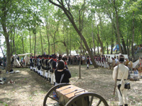 Photo:  Reenactors from the US Army Corps of Engineers “Captain Lewis’ Company,” the Discovery Expedition of Saint Charles, Fort Belle Fontaine State Park interpretive staff, and others, portray the US Army garrison of the Belle Fontaine Cantonment preparing to greet the expedition on its September 1806 return.