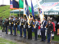 Photo: Another view of the multi-Service color guard.  The flags are arranged in precedence, with the National Colors to the right of the line, followed by the State flags and Service flags in order to seniority.  Absent from the color guard is the U.S. Marine Corps Flag, which is senior to all other Service flags with the exception of the U.S. Army.