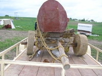 Another view of the front axle of the carriage.