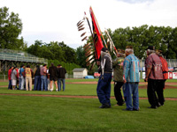 Photo:  Nez Perce Tribal Elders and Honor Guard, all US military veterans representing service from WWII to Vietnam, take part in the opening ceremony. 