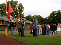 Photo:  Nez Perce Tribal Elders and Honor Guard, with the Lightning Creek Drums in the background, welcome all those attending the opening ceremony, as their ancestors had welcomed Lewis and Clark and the members of the Corps of Discovery two centuries ago. 