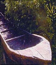 Photograph: Dugout canoes (above) and pirogues (top of page) were used to navigate rivers along the expeditions route. Dugout canoes were easy to maneuver in fast waters; however, it was challenging to keep them upright.