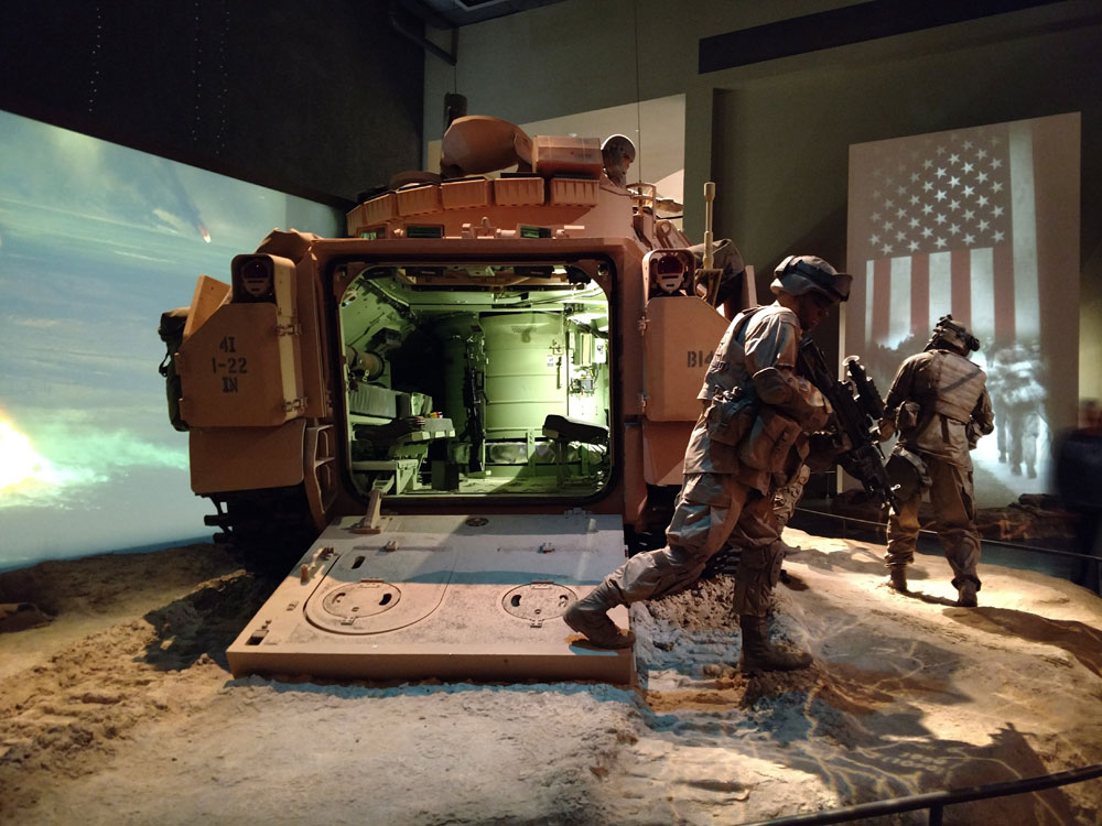 Museum display of Soldiers getting out of vehicle.