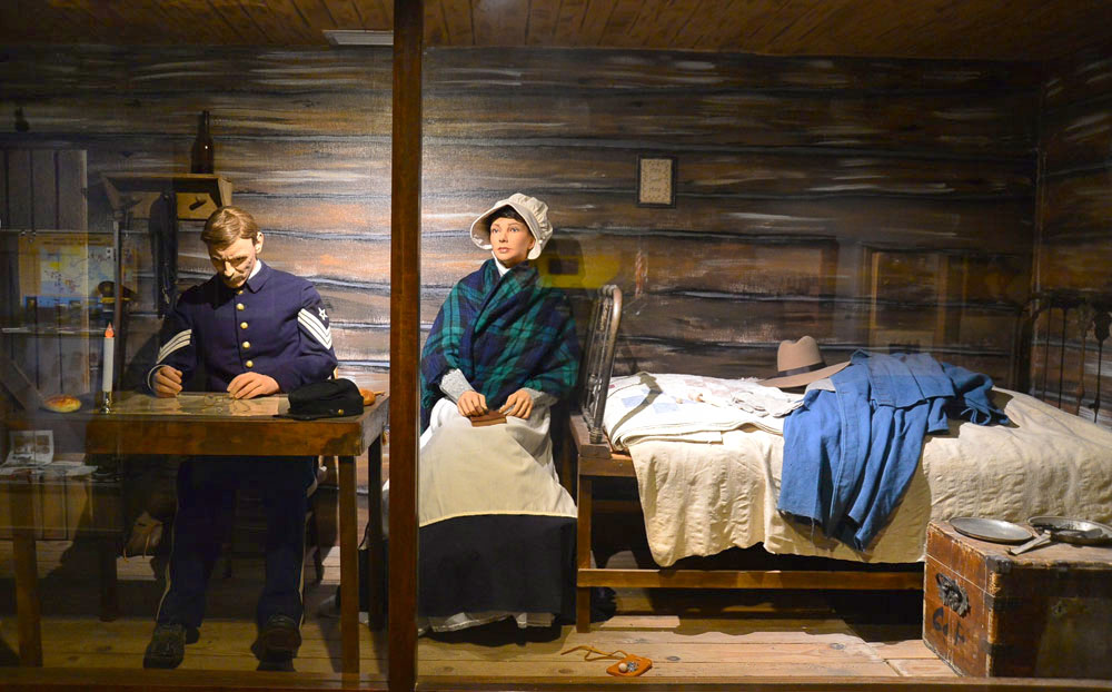 Exhibit featuring a man and woman inside a house inside the Noncommissioned Officer Heritage & Education Center.