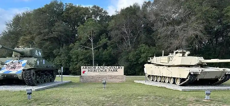 Image of the Musuem sign with two tanks 