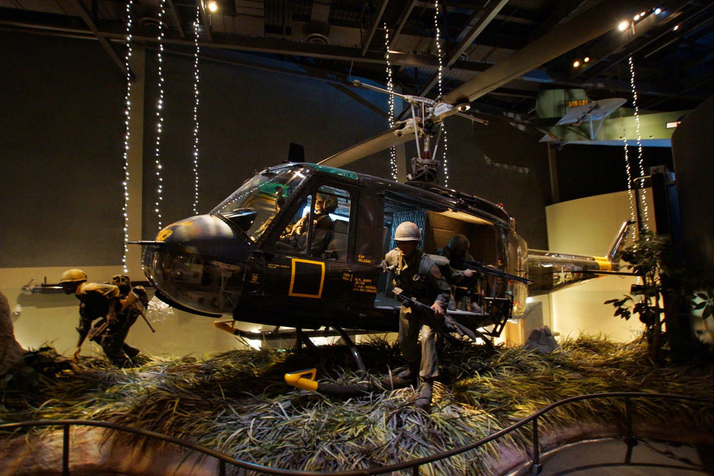 Museum display of Soldiers inside a helicopter.