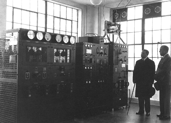 Photo:  David Sarnoff of RCA (left) and Captain Stoner, in charge of the War Department Message Center, inspect radio transmitters at Station WAR, Fort Myer, Virginia