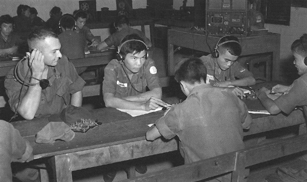 Photo:  Vietnamization-American soldier listens in to a class in radio code at the South Vietnamese Armed Forces Signal School, Vung Tau