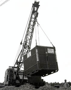 Hoisting CONEX container for convoy loading.