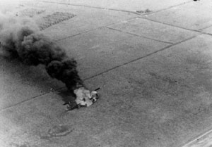 Major Hunt's gunship burns after landing.