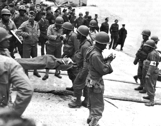 Photo: AMBULANCE MEN AT THE 14TH MAJOR PORT TRANSFERRING D-DAY CASUALTIES