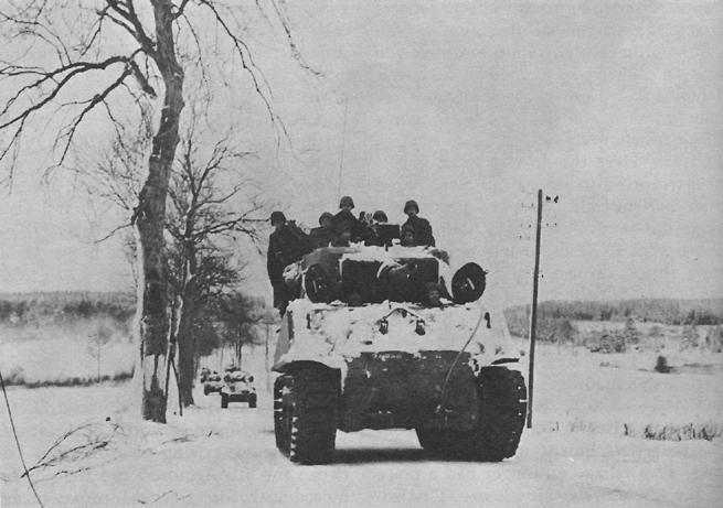 Photo:  Elements of the 3d Armored Division advancing near Manhay