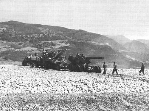 Photo:  Hauling a 155-mm. gun inland, Sicily