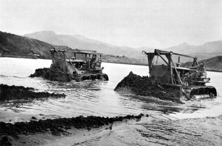 Photo: CONSTRUCTION ON ADAK. Dredging sand from an inlet to fill in the airfield.