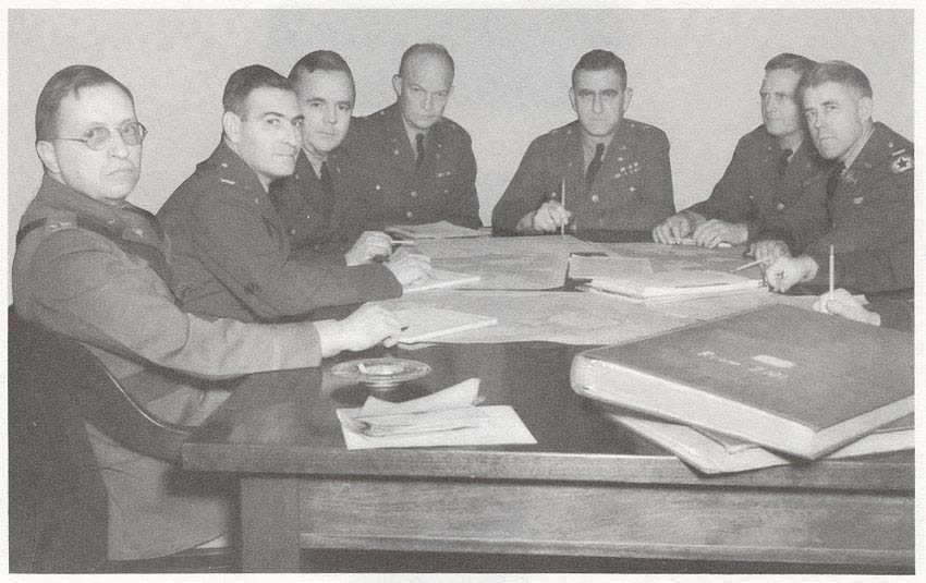 Photo: OFFICERS OF THE WAR PLANS DIVISION, 23 January 1942. Left to right: Col. W. K. Harrison, Col. Lee S. Gerow, Brig. Gen. Robert W. Crawford, Brig. Gen.  Dwight D. Eisenhower, Brig. Gen. Leonard T. Gerow, Chief, Col. Thomas T. Handy, Col. Stephen H. Sherrill.