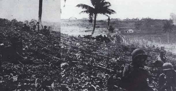 Black & White photo:  Pause in the battle in a coconut grove, 3d Battalion, 105th Infantry