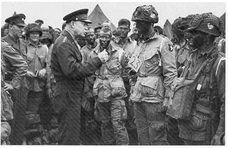 Photograph, The Supreme Commander talks with men of Company E in Greenham Common, England, 5 June 1944.