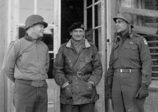 Left to right: Maj. Gen. J. Lawton Collins, Field Marshal Sir Bernard L. Montgomery, and Maj. Gen. Matthew B. Ridgway.