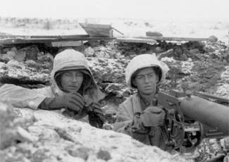 100th Infantry Division soldiers manning a defensive position.