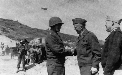 Photo:  Army Chief of Staff George C. Marshall (center) and Army Air Forces commander General Henry "Hap" Arnold confer with Bradley on the beach at Normandy, France, in 1944. 