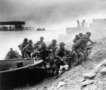 U.S. Seventh Army infantrymen climb the enemy-held east bank after crossing the Rhine.
