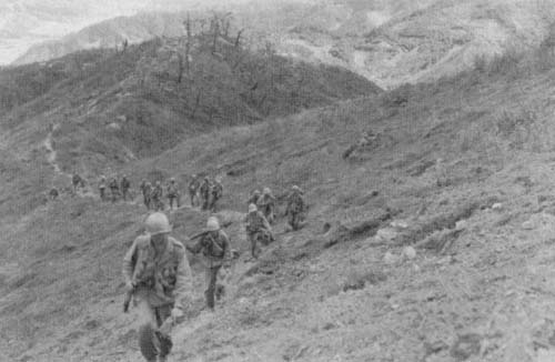 Photo: Company F, 9th Infantry, advances in central Korea.