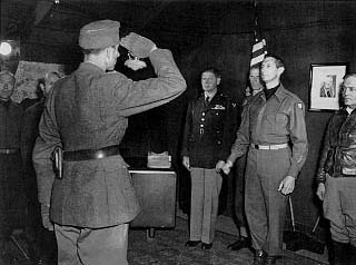 General von Senger surrenders to General Clark at Fifteenth Army Headquarters.