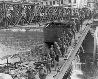 Troops of the 30th Infantry, 3d Division, cross the Doubs River.