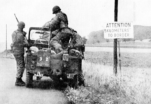 Photo: A border patrol dismounts to conduct a patrol just inside the 5-kilometer restricted zone. Circa 1960.
