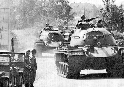 Photo: Members of the 3d Armored Cavalry Regiment respond to an alert exercise and move their M48 Medium Tanks of checkpoints along the border. August 1962.