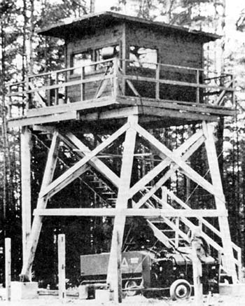 Photo: Close-up view of the wooden watchtower on one of the 11th Armored Cavalry Regiment's observation posts. The newer, modern steel towers were abandoned because they were unsafe.