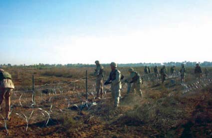 Construction of the finest gated community in Abu Hishma. We surrounded the town with concertina wire after numerous attacks on American forces.