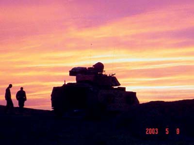 Spc. Jason Boothby and 1st Lt. Jimmy Bevens enjoy a sunset in northern Iraq.