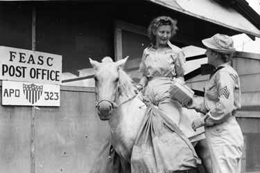 >Cpl. Frances Burnette and Sgt. Lucy Bloom are delivering mail in Manila