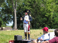 Photo: Dr. Stearns is seen here entertaining visitors to the encampment with a speech that William Clark might have given himself as he reflected upon the achievements of the expedition in later years.