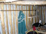 Photo: Clark’s winter coat and spontoon on the wall of the officer’s quarters at Fort Mandan. 