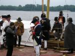 Photo: A interpreter is seen here demonstrating how Soldiers loaded their muskets to a member of the press.