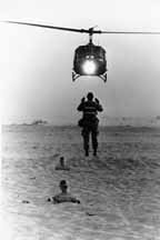 Soldier directing the landing of a UH-1V Iroquois ("Huey") helicopter ambulance