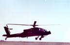 AH-64 Apache; flying low over compounds of 676th and 587th Maintenance Companies.