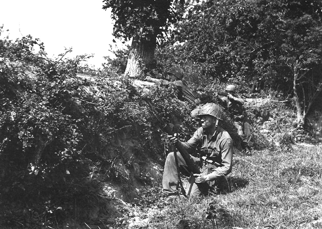 Photo:  Infantrymen in action in the Hedgerows