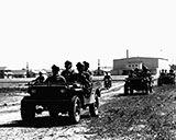 9th Cavalry riding in jeep